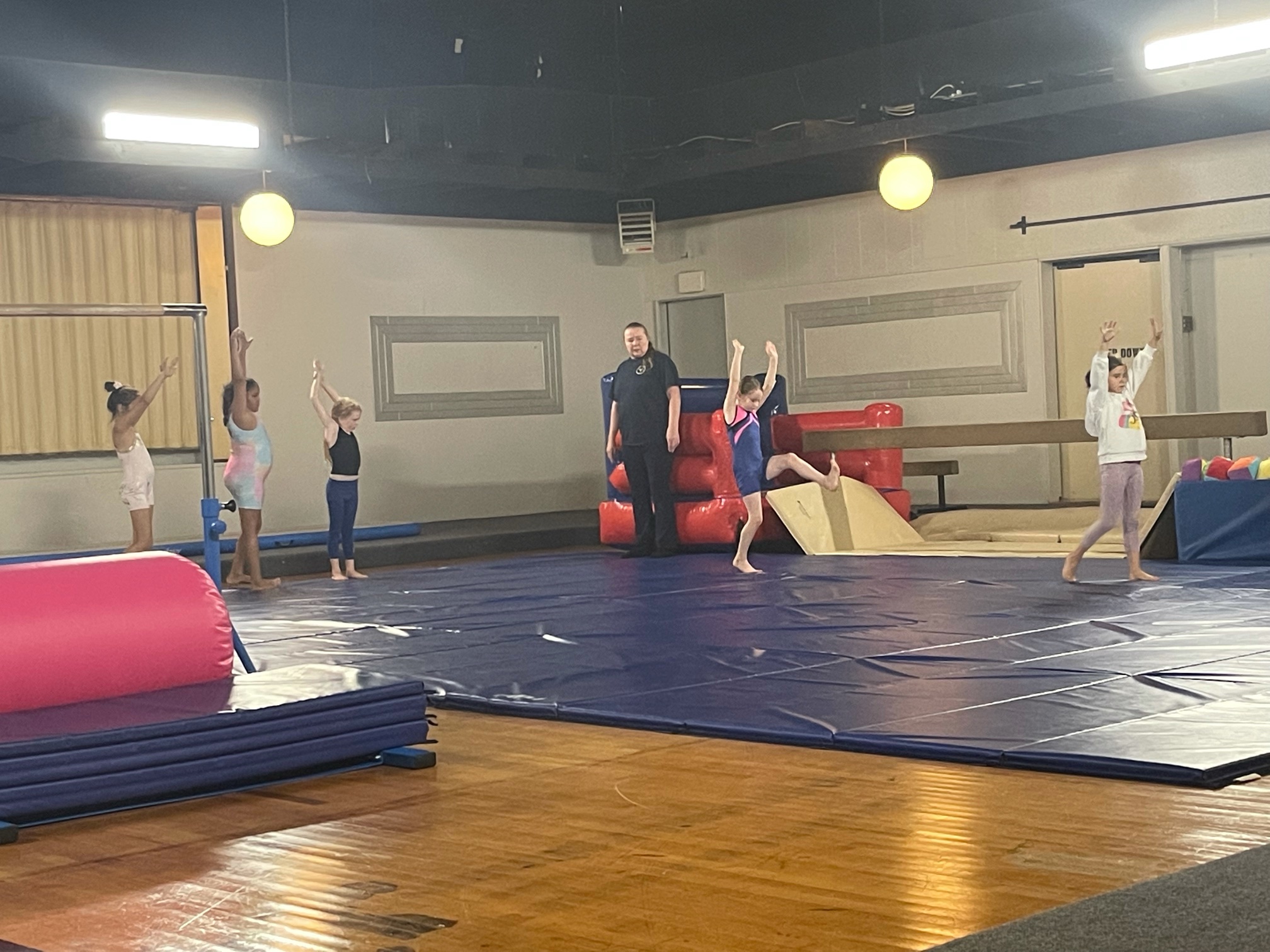 kids learning gymnastics